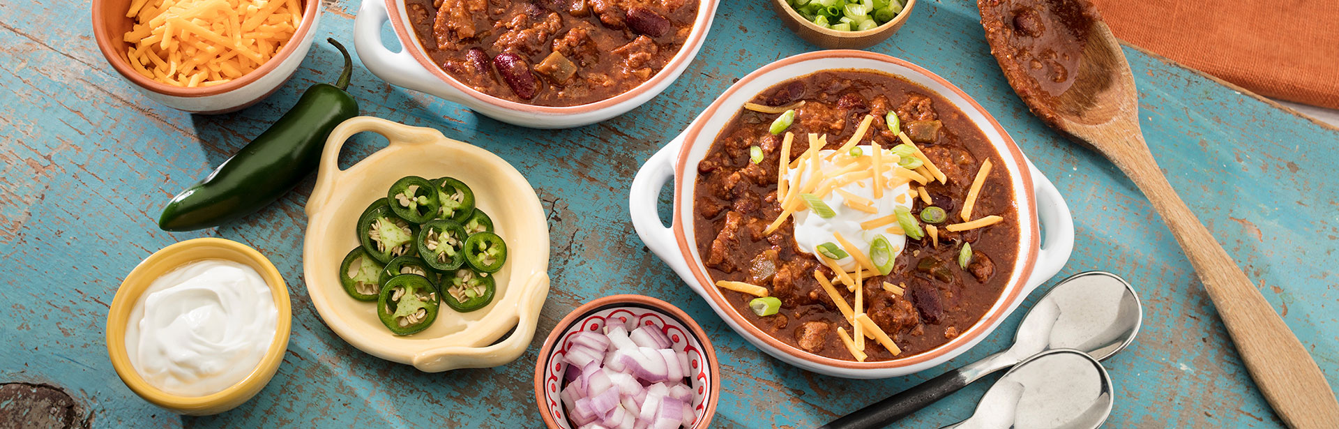 An image of prepared Slow Cooker Chili made with ground beef, chili powder, ground cumin, Pace® Chunky Salsa and kidney beans.